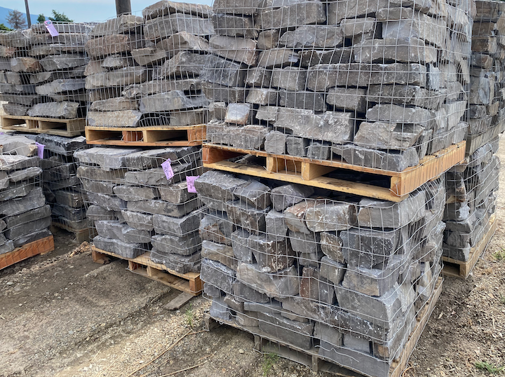 A quarry's castle stone await shipment for a castle wall under construction August 15, 2024